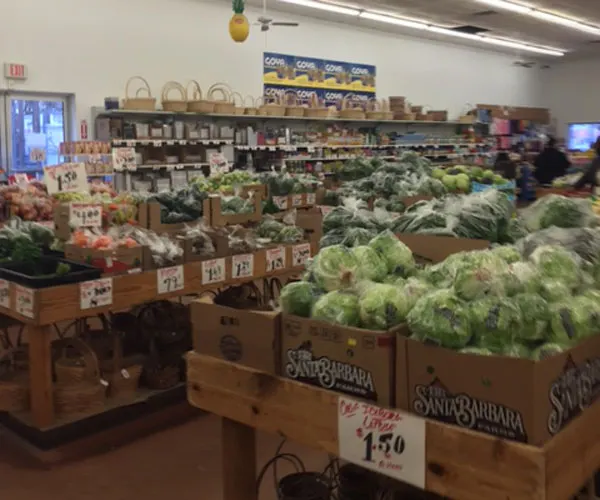 Boxes of fresh lettuce in the produce section